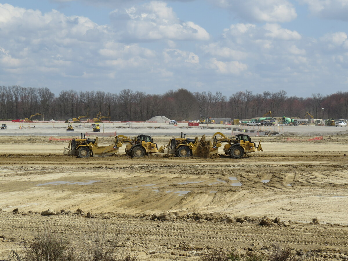 air view of field and construction crew