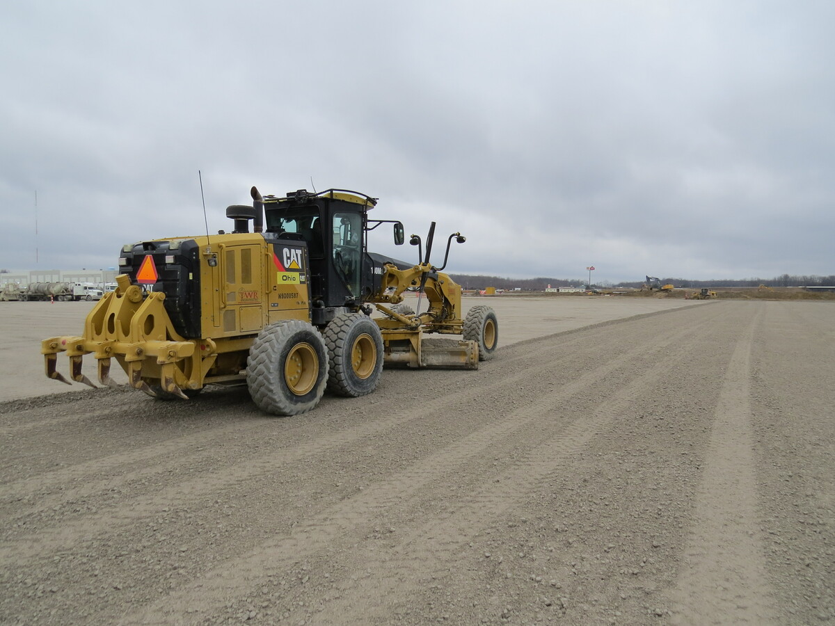 trucks in dirt field