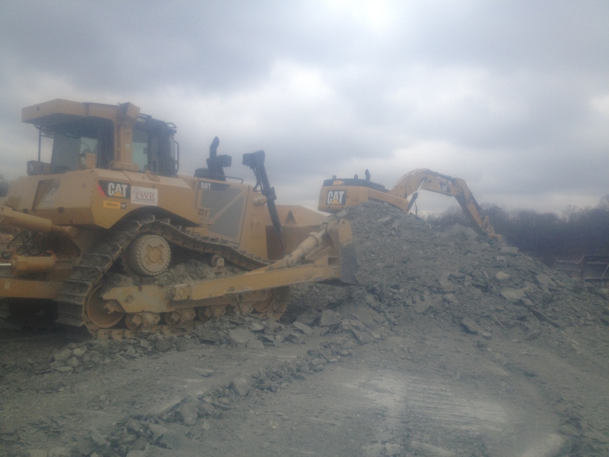 bulldozer pushing rocks