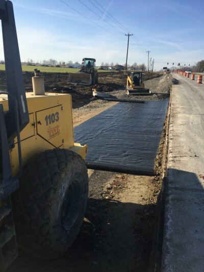 vehicles paving